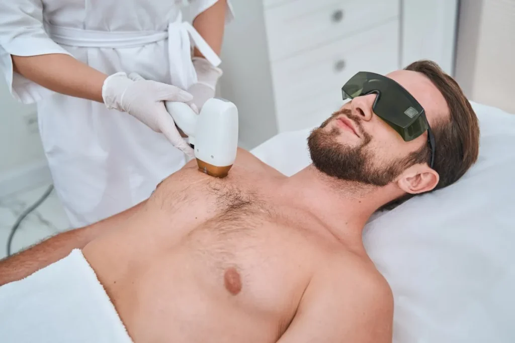 man receiving laser treatment on his chest